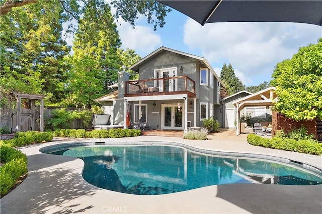 6 Stansbury Ct, Chico, CA 95928 - rear view of property with french doors, a balcony, a patio, and a gate