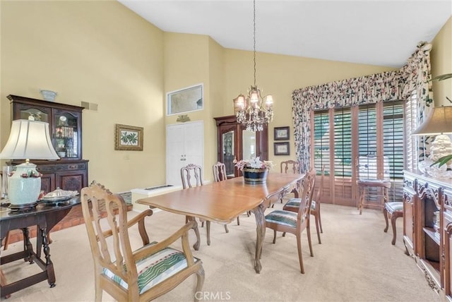 6232 E Shenandoah Ave, Orange, CA 92867 - dining room featuring a chandelier, light carpet, and high vaulted ceiling