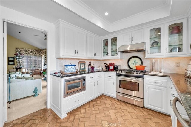 6232 E Shenandoah Ave, Orange, CA 92867 - kitchen with stainless steel appliances, under cabinet range hood, brick patterned flooring, white cabinets, and glass insert cabinets