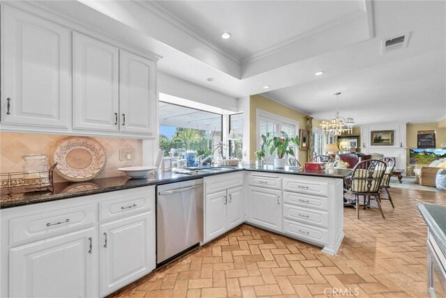 6232 E Shenandoah Ave, Orange, CA 92867 - kitchen with stainless steel dishwasher, backsplash, a chandelier, crown molding, and a peninsula