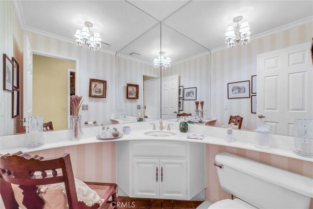 6232 E Shenandoah Ave, Orange, CA 92867 - bathroom featuring a chandelier, wallpapered walls, ornamental molding, and vanity