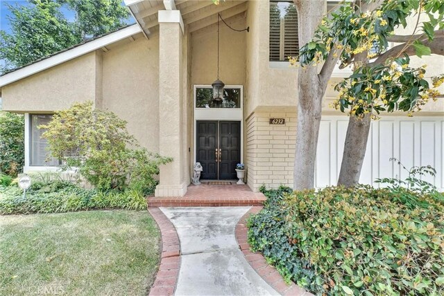 6232 E Shenandoah Ave, Orange, CA 92867 - doorway to property featuring brick siding and stucco siding