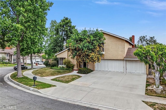 6232 E Shenandoah Ave, Orange, CA 92867 - view of front of property featuring stucco siding, concrete driveway, and a garage