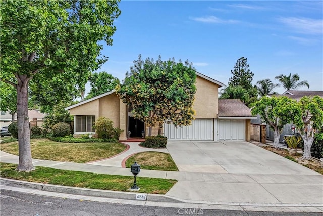 6232 E Shenandoah Ave, Orange, CA 92867 - view of front facade featuring stucco siding, concrete driveway, and a garage