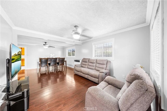 157 E 70th St, Los Angeles, CA 90003 - living room featuring ceiling fan, a textured ceiling, wood finished floors, crown molding, and baseboards