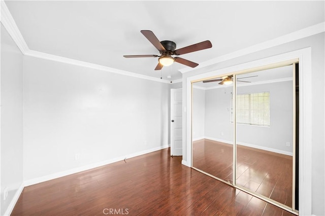 157 E 70th St, Los Angeles, CA 90003 - unfurnished bedroom with crown molding, wood finished floors, baseboards, a closet, and ceiling fan