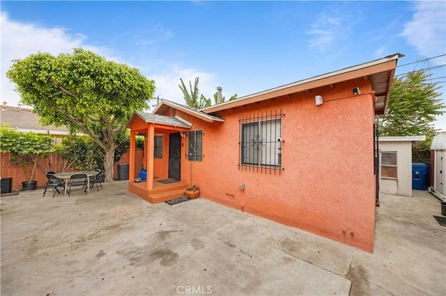 157 E 70th St, Los Angeles, CA 90003 - back of house featuring a patio and stucco siding
