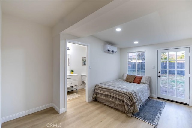 12563 3rd St, Yucaipa, CA 92399 - bedroom featuring a wall mounted AC, access to exterior, light wood-type flooring, baseboards, and recessed lighting
