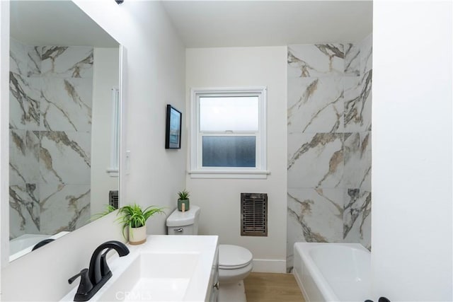 12563 3rd St, Yucaipa, CA 92399 - full bathroom featuring toilet, vanity, wood finished floors, and baseboards