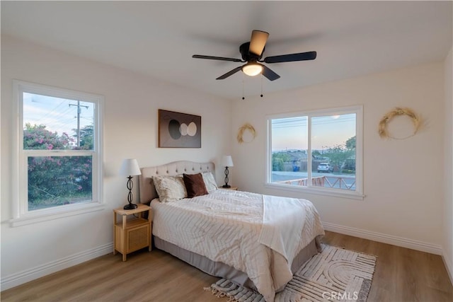 12563 3rd St, Yucaipa, CA 92399 - bedroom featuring light wood-style floors, baseboards, and a ceiling fan