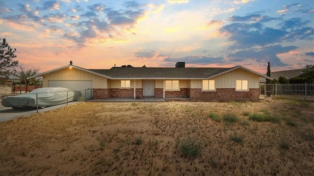 21248 Rancherias Rd, Apple Valley, CA 92307 - single story home featuring brick siding, an attached garage, and driveway