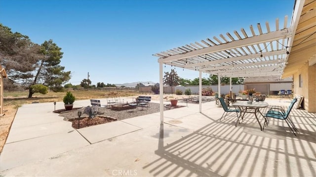 21248 Rancherias Rd, Apple Valley, CA 92307 - view of patio featuring an outdoor fire pit, outdoor dining space, and a pergola
