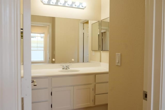 7040 Whitewater St, Carlsbad, CA 92011 - bathroom with vanity and a textured wall