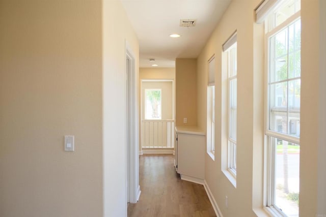 7040 Whitewater St, Carlsbad, CA 92011 - hallway featuring wood finished floors and recessed lighting