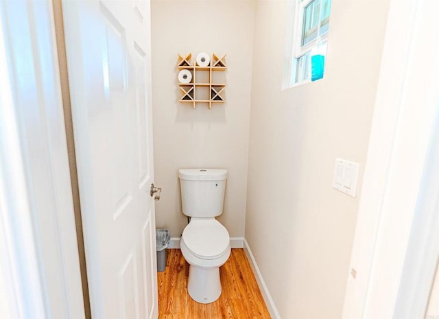 7040 Whitewater St, Carlsbad, CA 92011 - bathroom with wood finished floors and toilet
