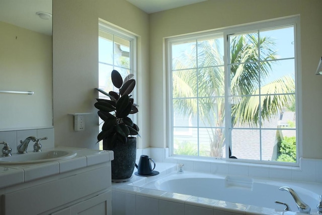 7040 Whitewater St, Carlsbad, CA 92011 - bathroom with a garden tub, vanity, and tasteful backsplash