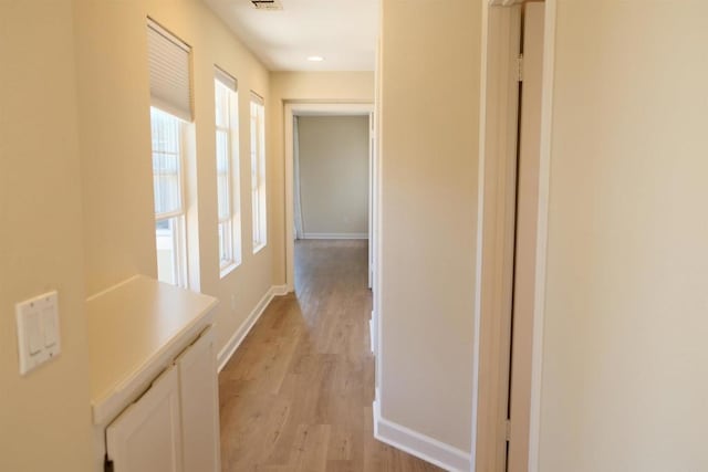 7040 Whitewater St, Carlsbad, CA 92011 - hallway featuring baseboards and light wood-type flooring