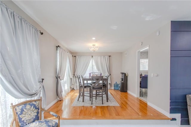 2546 Northmoor Dr, Corona, CA 92882 - dining space with wood finished floors, baseboards, and a chandelier