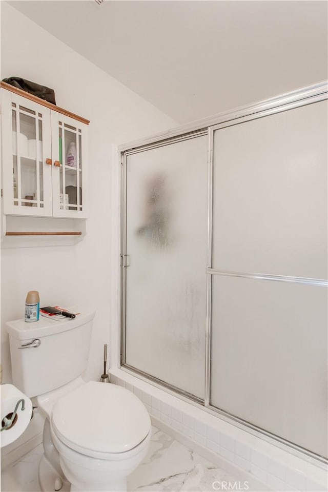 2546 Northmoor Dr, Corona, CA 92882 - bathroom featuring marble finish floors, toilet, and a shower with shower door