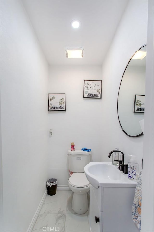 2546 Northmoor Dr, Corona, CA 92882 - half bath with vanity, toilet, baseboards, marble finish flooring, and recessed lighting