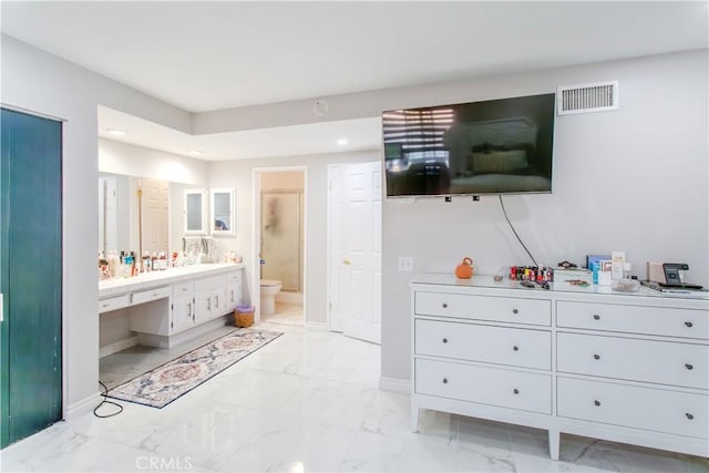 2546 Northmoor Dr, Corona, CA 92882 - bathroom with vanity, toilet, marble look tile flooring, recessed lighting, and baseboards