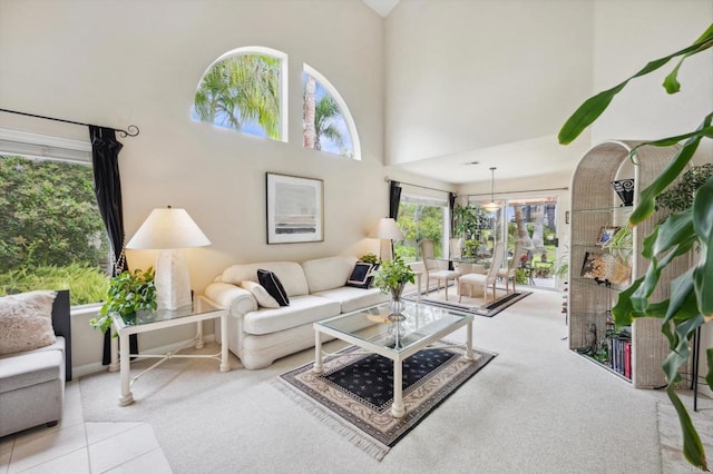 6839 Caminito Sueno, Carlsbad, CA 92009 - living area featuring carpet flooring, a towering ceiling, and baseboards