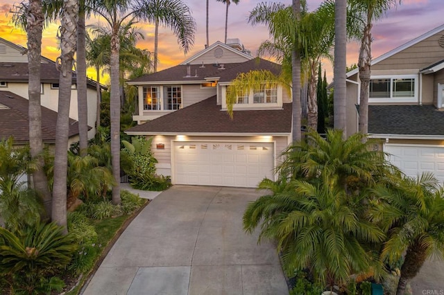 6839 Caminito Sueno, Carlsbad, CA 92009 - traditional-style home with driveway, an attached garage, and roof with shingles