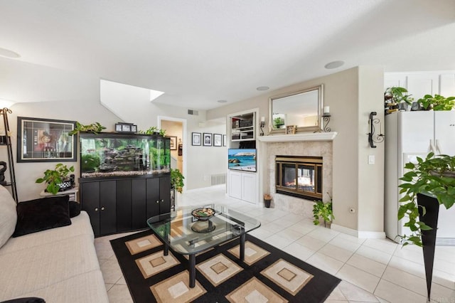 6839 Caminito Sueno, Carlsbad, CA 92009 - living area with light tile patterned floors, a tiled fireplace, and built in shelves