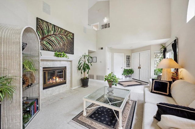 6839 Caminito Sueno, Carlsbad, CA 92009 - carpeted living room with a high ceiling and a tiled fireplace
