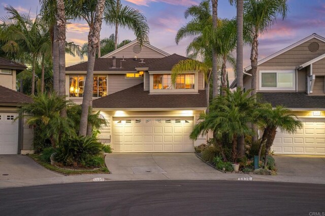 6839 Caminito Sueno, Carlsbad, CA 92009 - view of front of home with concrete driveway, an attached garage, and roof with shingles