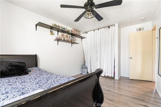 5950 Imperial Hwy Unit 48, South Gate, CA 90280 - bedroom featuring light wood-style flooring, ceiling fan, and baseboards