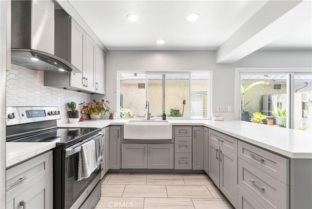 5950 Imperial Hwy Unit 48, South Gate, CA 90280 - kitchen featuring wall chimney range hood, stainless steel range with electric stovetop, gray cabinets, a sink, and recessed lighting