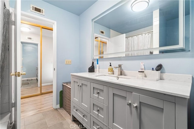 5950 Imperial Hwy Unit 48, South Gate, CA 90280 - bathroom featuring vanity, tile patterned flooring, and baseboards