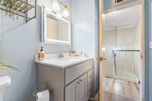 5950 Imperial Hwy Unit 48, South Gate, CA 90280 - bathroom with toilet, vanity, and wood finished floors