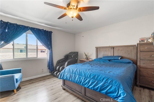 5950 Imperial Hwy Unit 48, South Gate, CA 90280 - bedroom featuring wood finished floors, baseboards, and ceiling fan