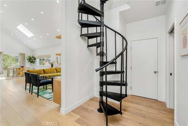 2240 Ewing St, Los Angeles, CA 90039 - stairway featuring wood finished floors, recessed lighting, and high vaulted ceiling