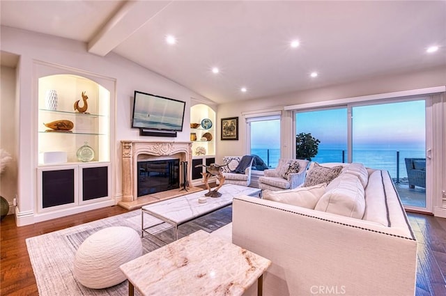 1155 Katella St, Laguna Beach, CA 92651 - living area with dark wood-style floors, a premium fireplace, recessed lighting, and built in shelves