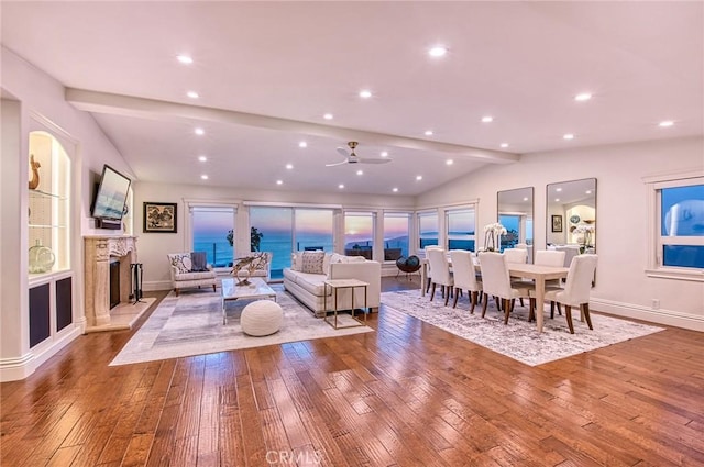 1155 Katella St, Laguna Beach, CA 92651 - living room featuring vaulted ceiling, hardwood / wood-style floors, a fireplace with raised hearth, recessed lighting, and baseboards