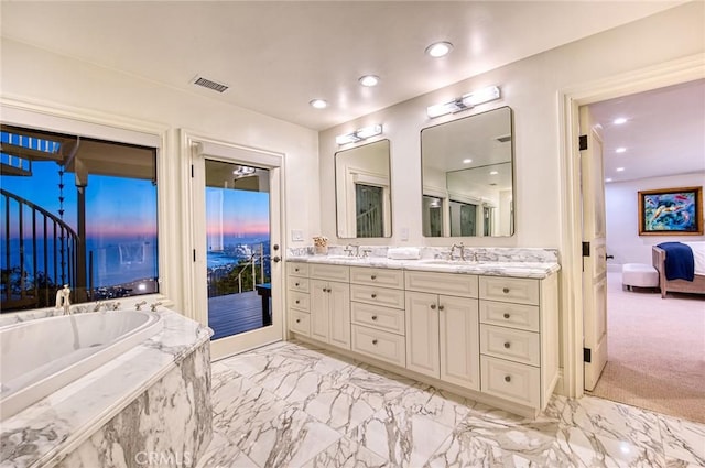 1155 Katella St, Laguna Beach, CA 92651 - ensuite bathroom featuring double vanity, marble finish flooring, a tub with marble appearance, and recessed lighting