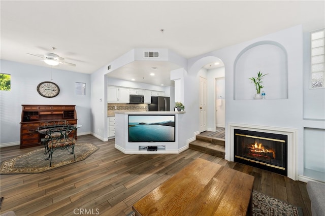 12909 Ternberry Ct, Tustin, CA 92782 - living area with dark wood-type flooring, a ceiling fan, and baseboards