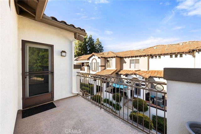 12909 Ternberry Ct, Tustin, CA 92782 - entrance to property featuring a balcony, stucco siding, and a residential view