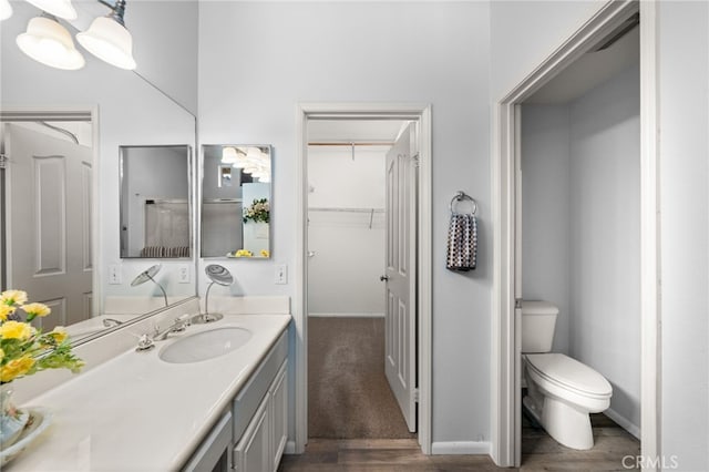 12909 Ternberry Ct, Tustin, CA 92782 - full bath featuring toilet, vanity, wood finished floors, and baseboards