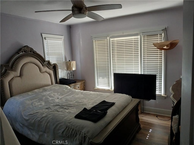 1831 W 68th St, Los Angeles, CA 90047 - bedroom featuring wood finished floors, ceiling fan, and baseboards