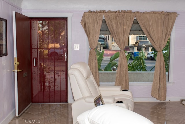 1831 W 68th St, Los Angeles, CA 90047 - sitting room featuring marble finish flooring and baseboards