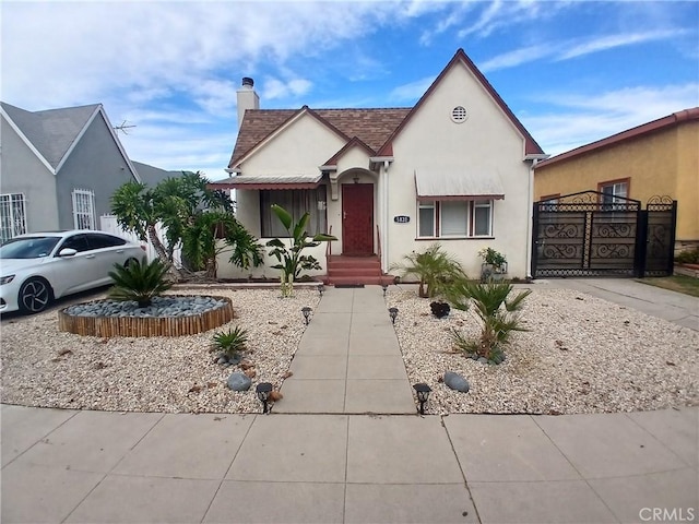 1831 W 68th St, Los Angeles, CA 90047 - view of front of property with a chimney and stucco siding
