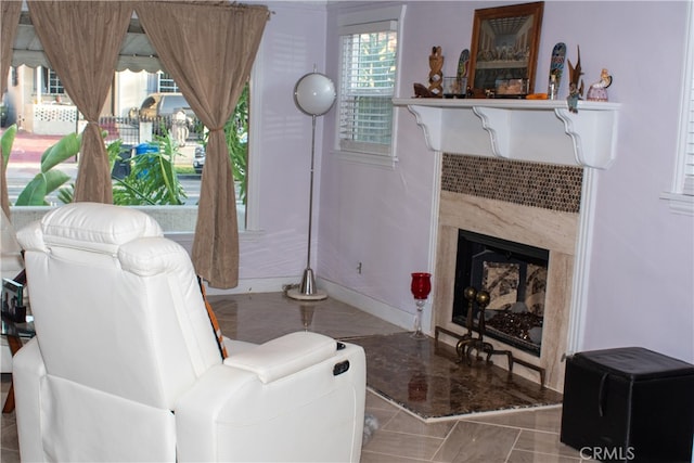 1831 W 68th St, Los Angeles, CA 90047 - living room featuring tile patterned floors, a tile fireplace, and baseboards