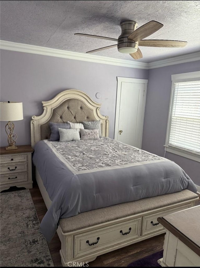 1831 W 68th St, Los Angeles, CA 90047 - bedroom featuring a textured ceiling, ornamental molding, dark wood-style floors, and a ceiling fan