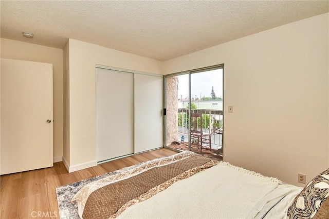 4838 Elrovia Ave Unit E, El Monte, CA 91732 - bedroom featuring access to exterior, wood finished floors, a closet, and baseboards