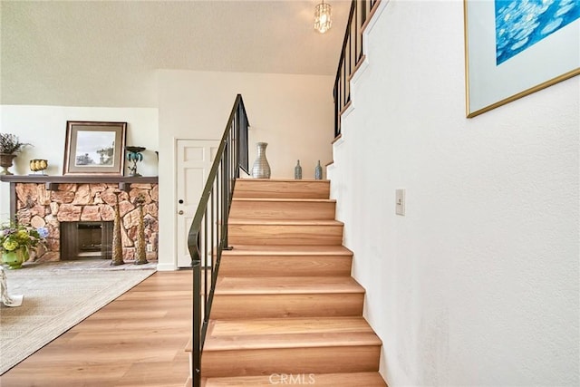 4838 Elrovia Ave Unit E, El Monte, CA 91732 - stairway with wood finished floors and a fireplace