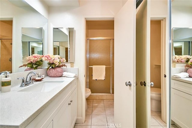 4838 Elrovia Ave Unit E, El Monte, CA 91732 - bathroom featuring toilet, vanity, tile patterned flooring, and a shower stall
